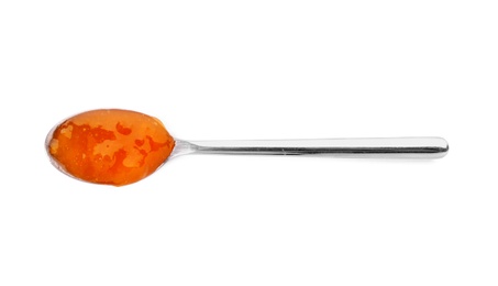 Photo of Spoon with tasty apricot jam on white background, top view