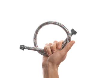 Photo of Male plumber holding flexible hose on white background, closeup