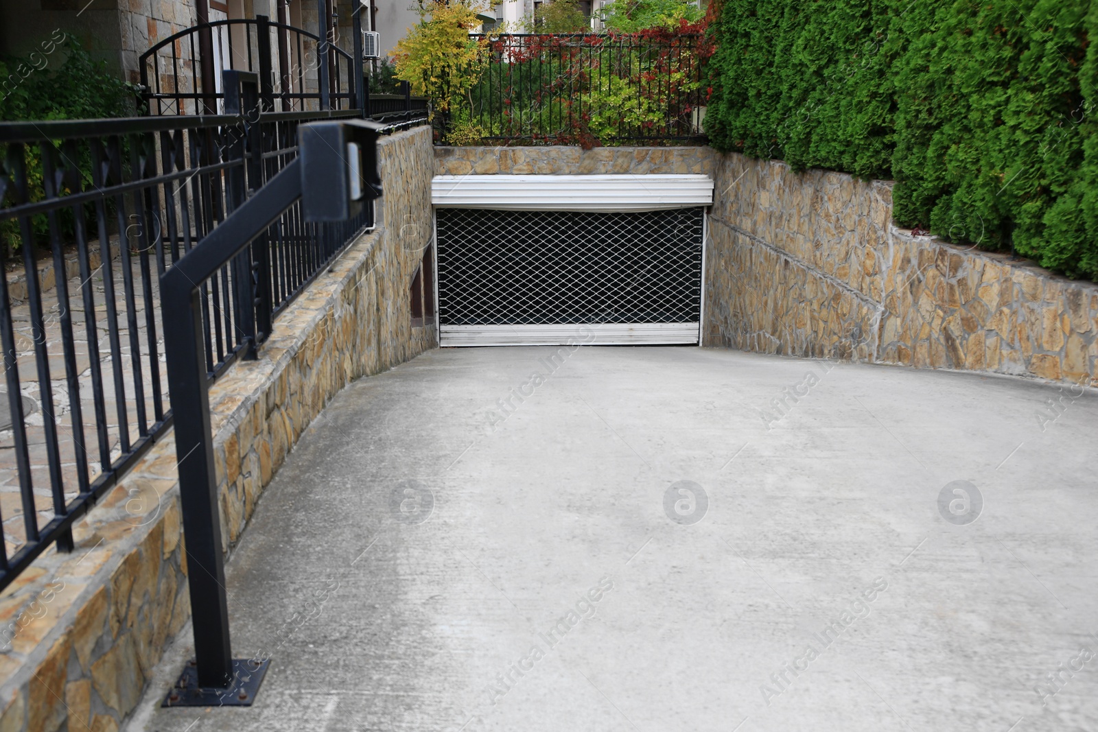 Photo of Closed underground parking with modern intercom system