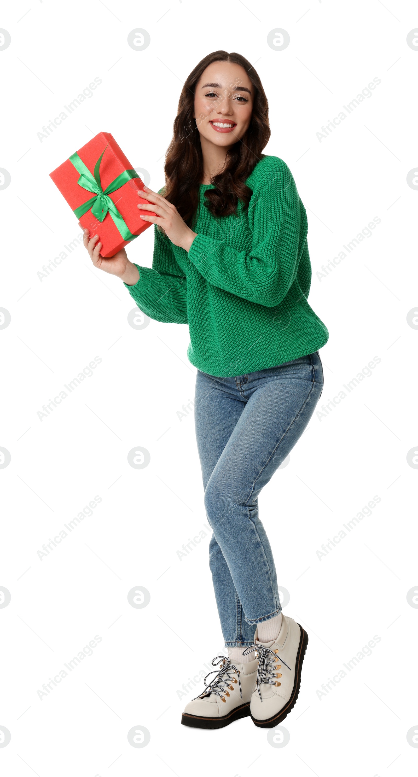 Photo of Beautiful young woman with Christmas gift isolated on white