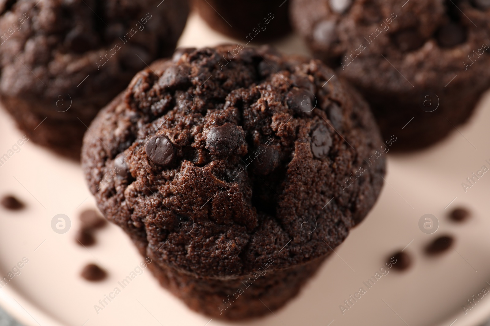 Photo of Delicious fresh chocolate muffins on table, closeup