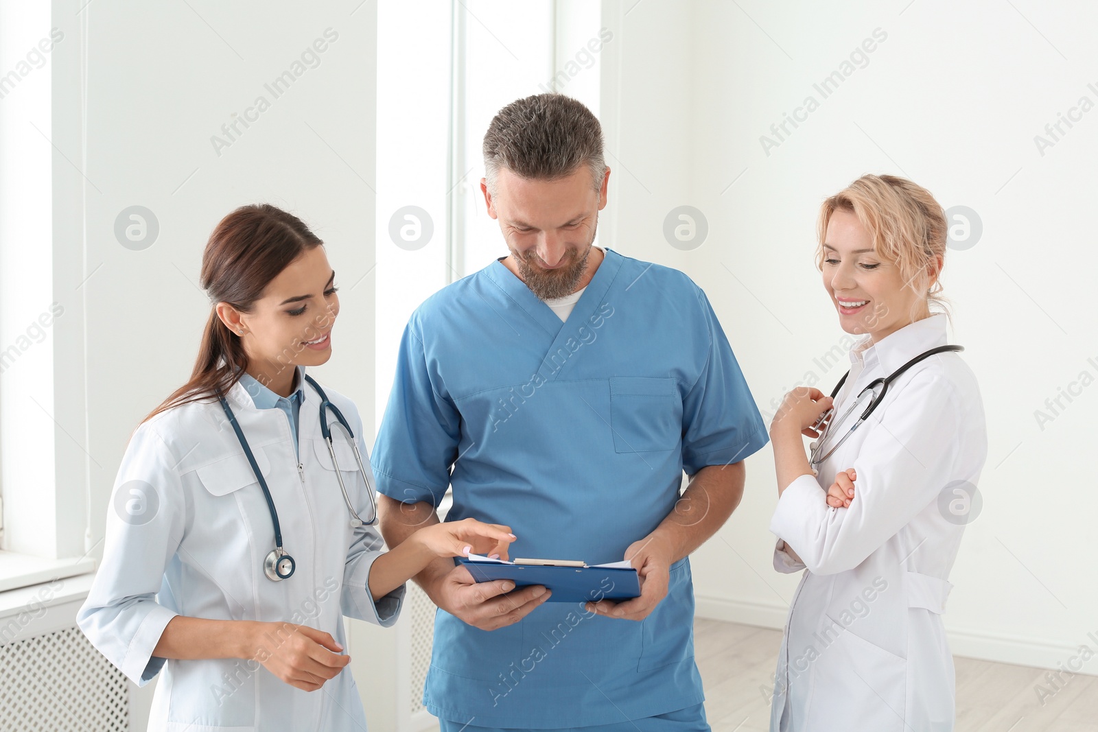 Photo of Doctors and medical assistant in clinic. Health care service