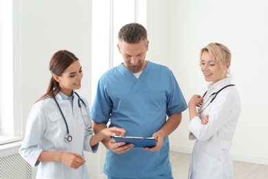 Photo of Doctors and medical assistant in clinic. Health care service