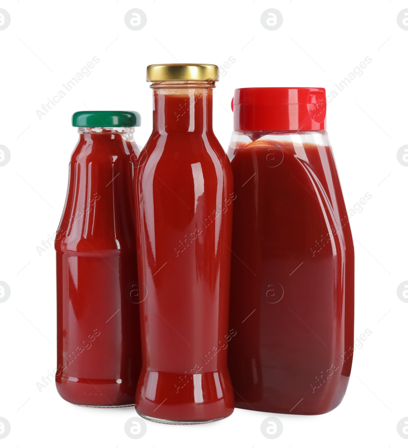 Photo of Different bottles of ketchup on white background