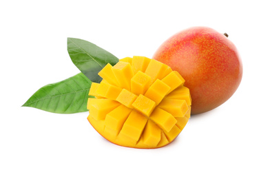 Whole and cut ripe mangoes isolated on white. Exotic fruit