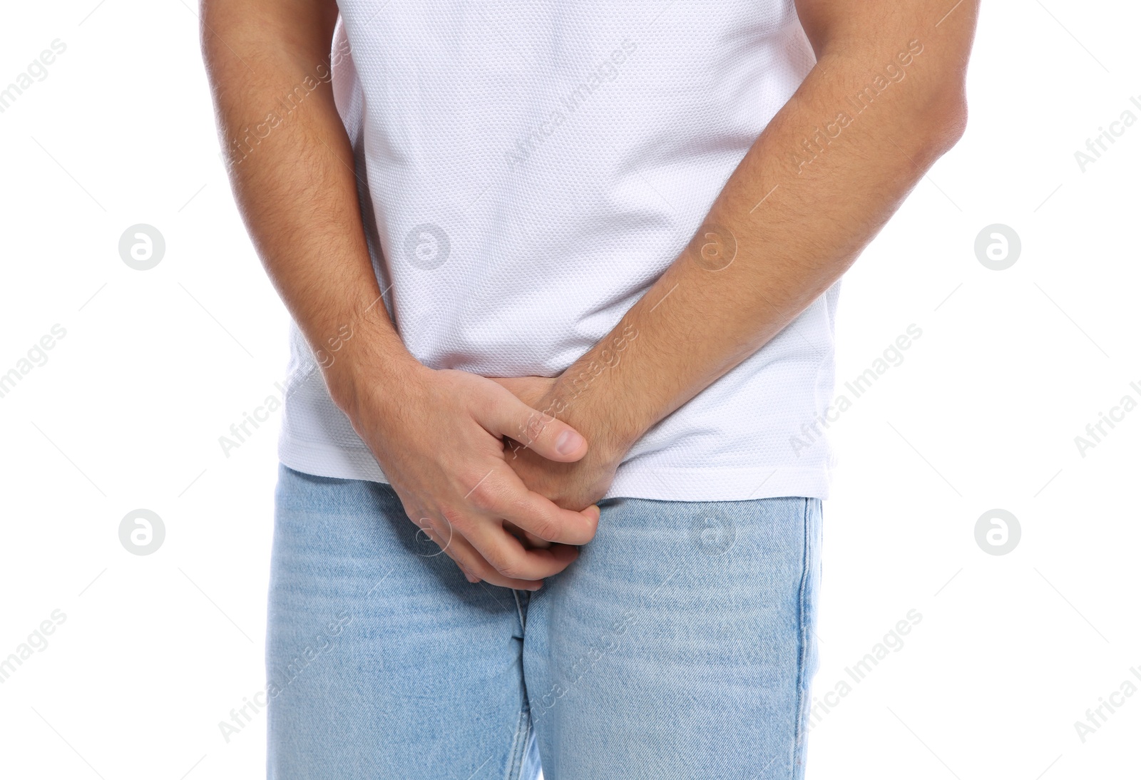 Photo of Man with itching crotch on white background, closeup