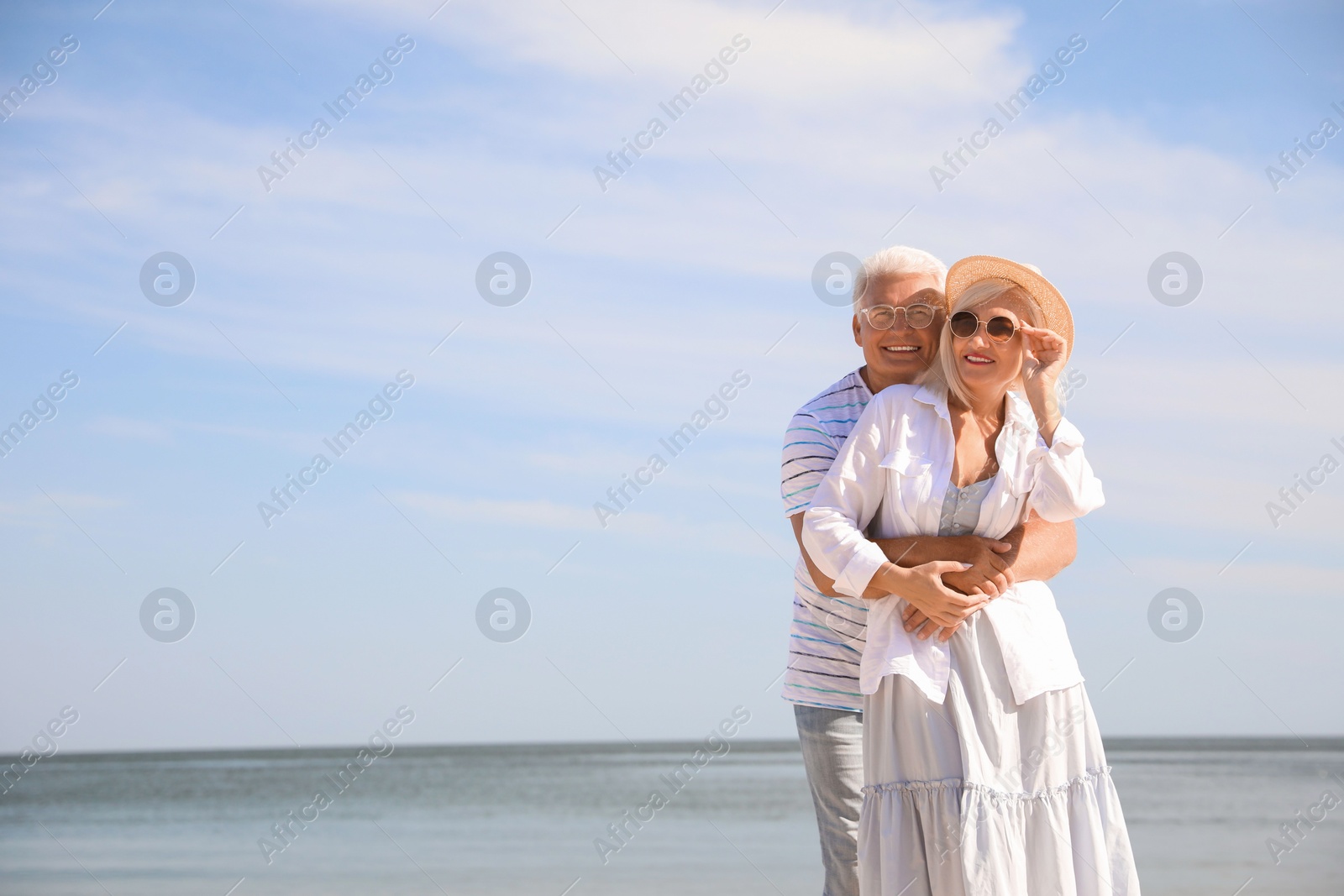 Photo of Mature couple spending time together near sea