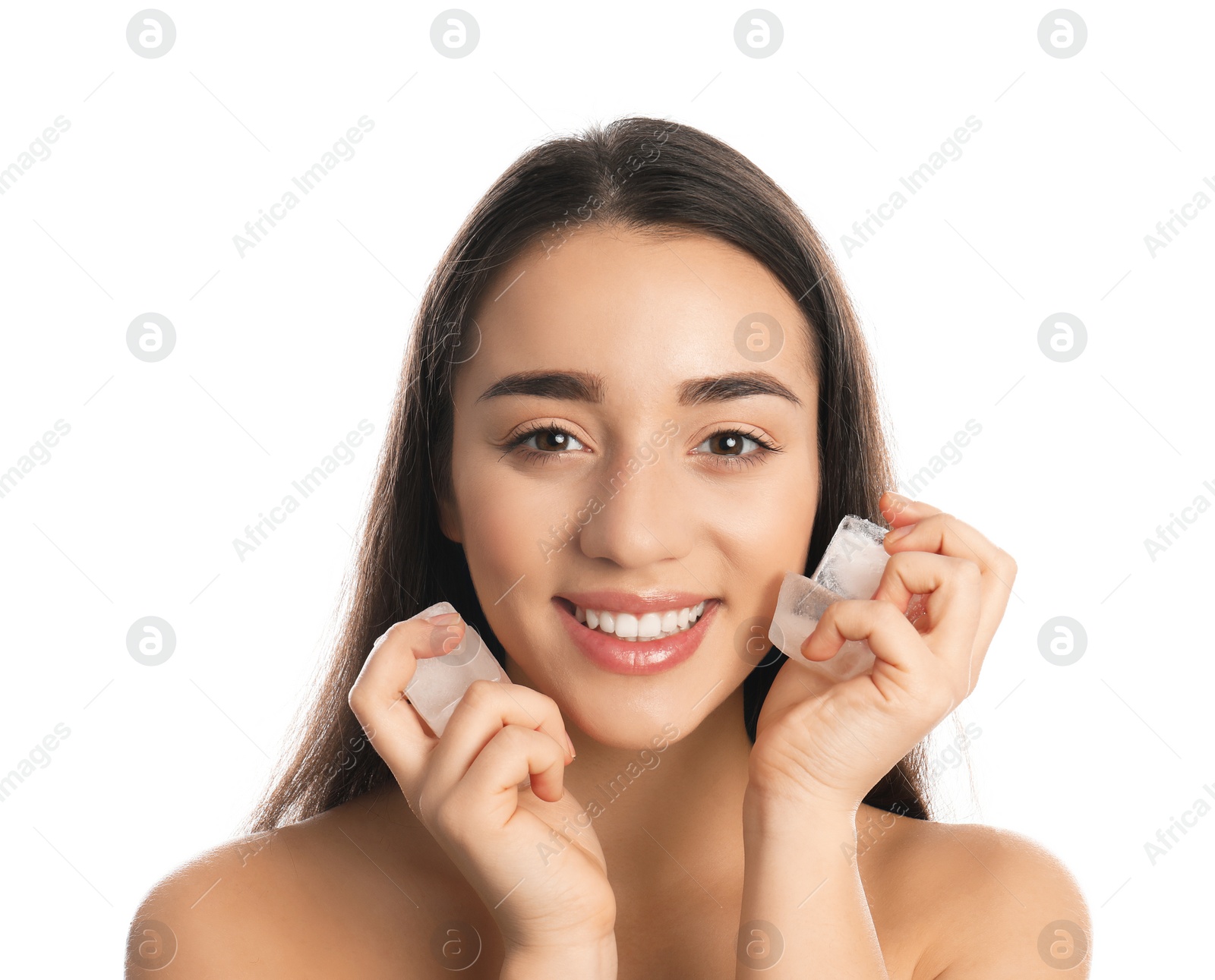 Photo of Young woman with ice cubes on white background. Skin care