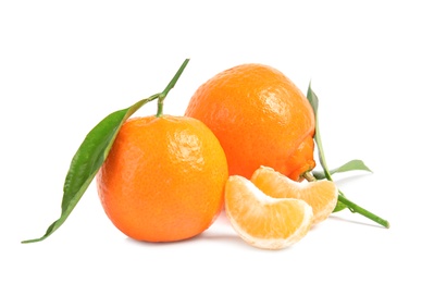 Photo of Tasty ripe tangerines with leaves on white background