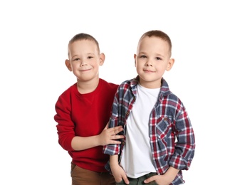 Photo of Portrait of cute twin brothers on white background