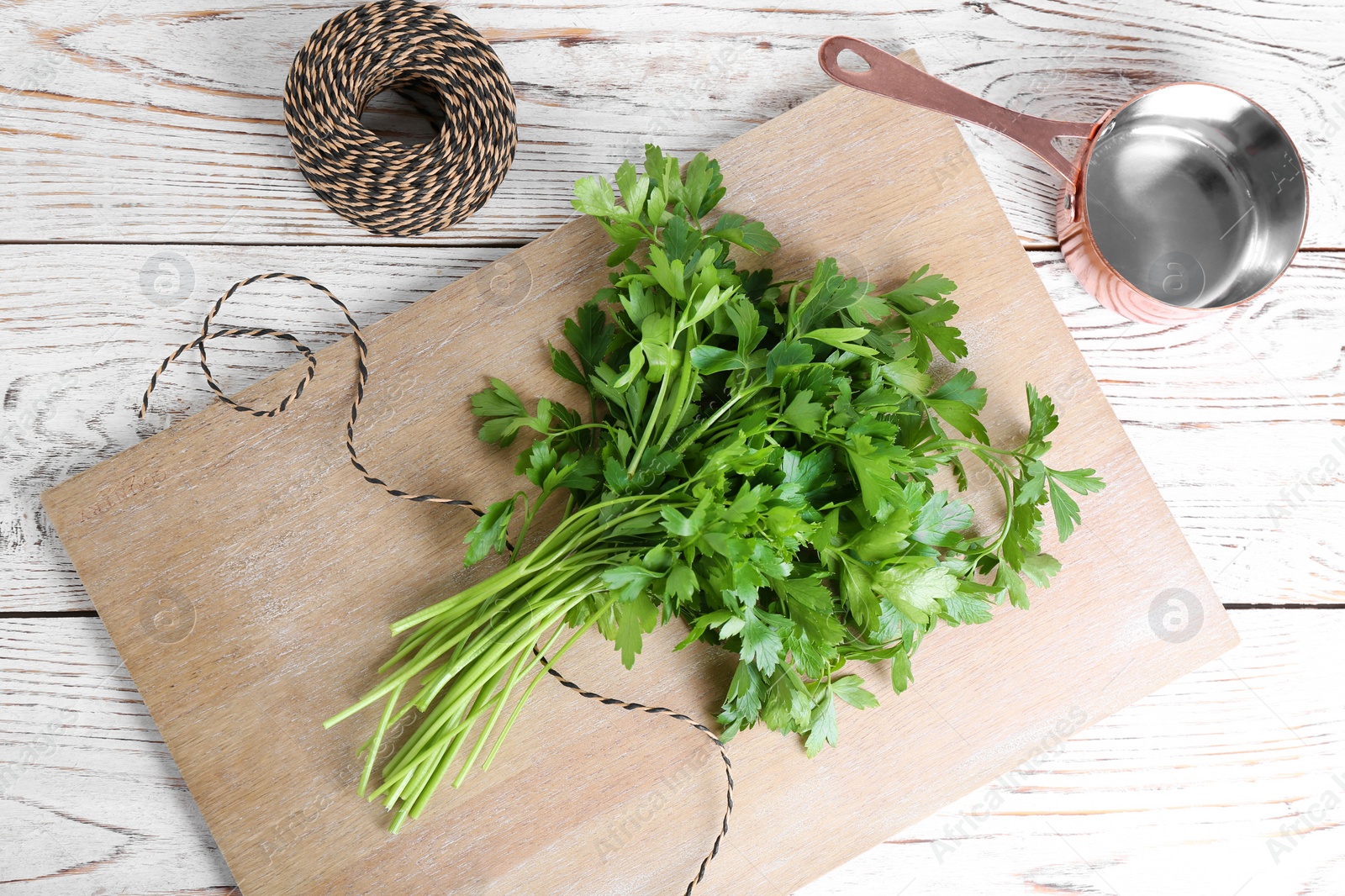 Photo of Flat lay composition with fresh green parsley on wooden background