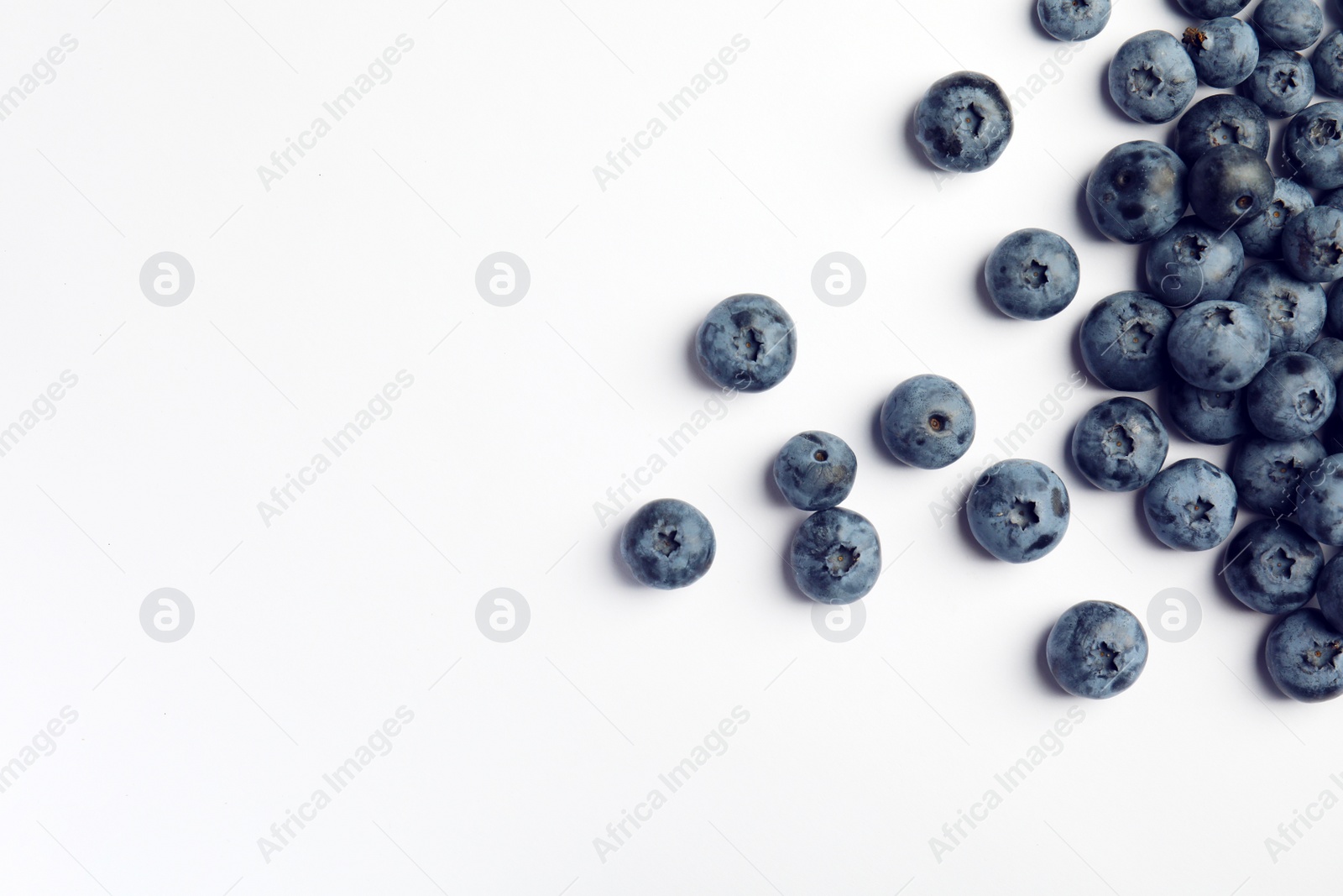 Photo of Flat lay composition with tasty blueberry and space for text on white background