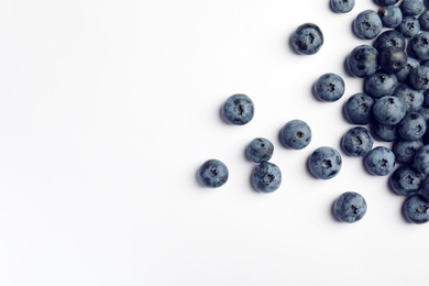 Photo of Flat lay composition with tasty blueberry and space for text on white background