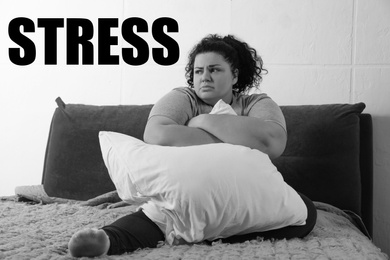 Overweight woman suffering from depression at home and word STRESS