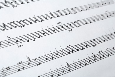 Photo of Paper sheet with musical notes, closeup view