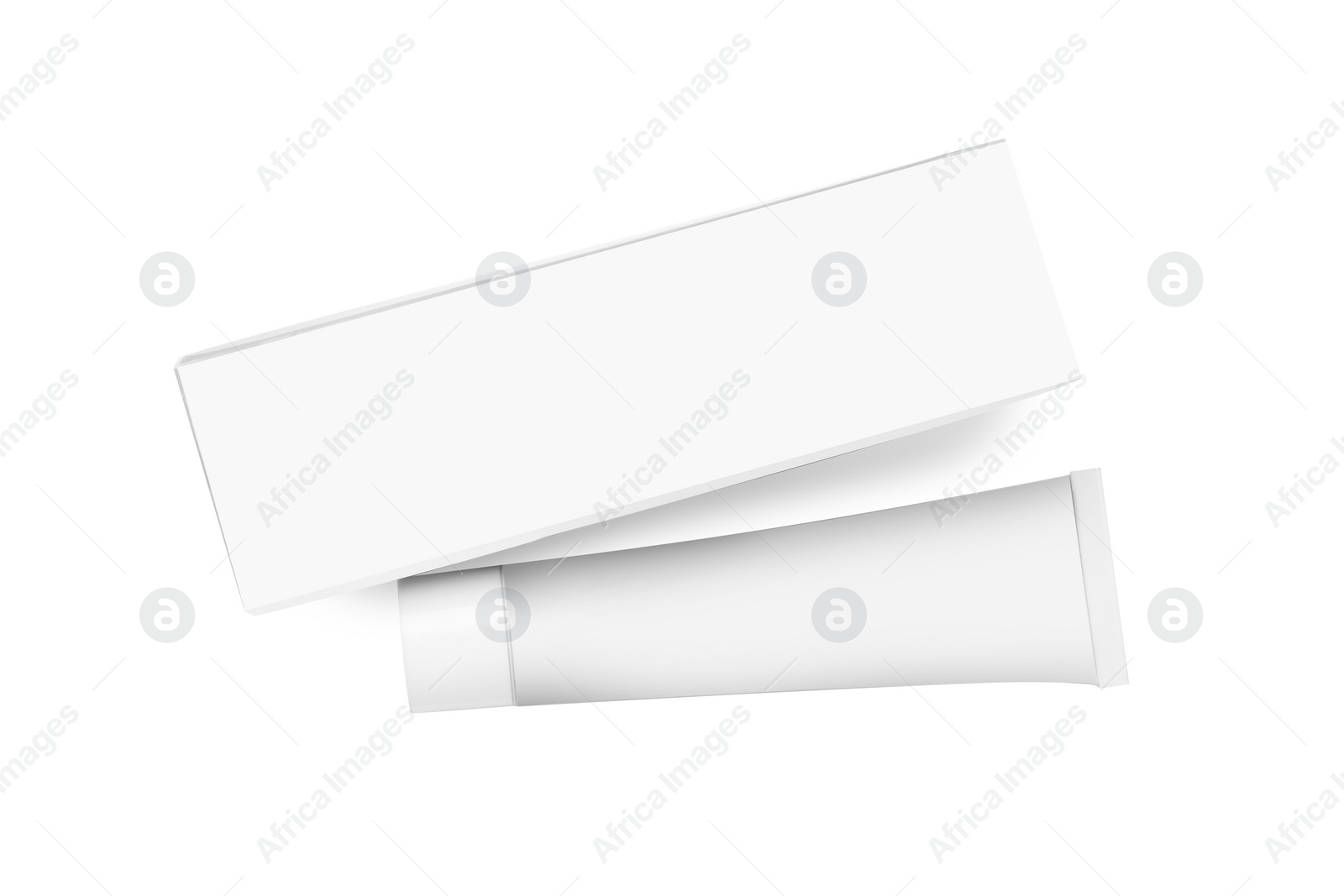 Photo of Tube of ointment and box isolated on white, top view. Space for text