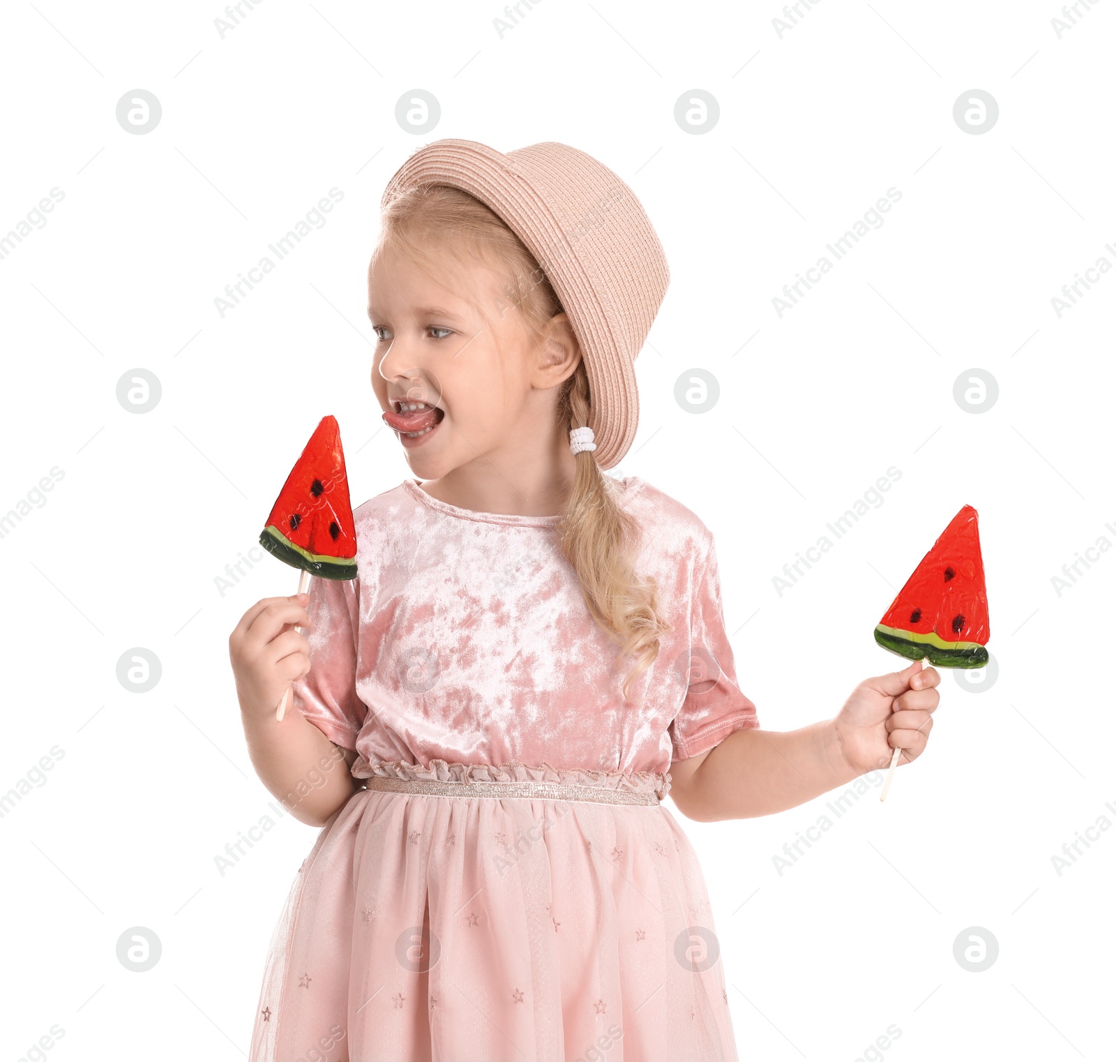 Photo of Cute little girl with candies on white background