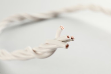Photo of Closeup view of electrical power cables on white background