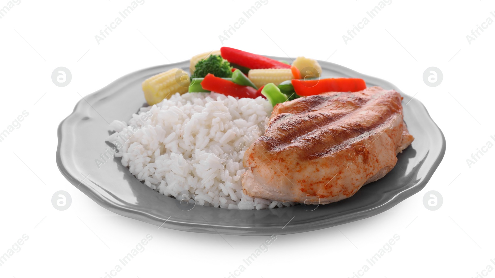 Photo of Plate with grilled chicken breast, rice and vegetables isolated on white