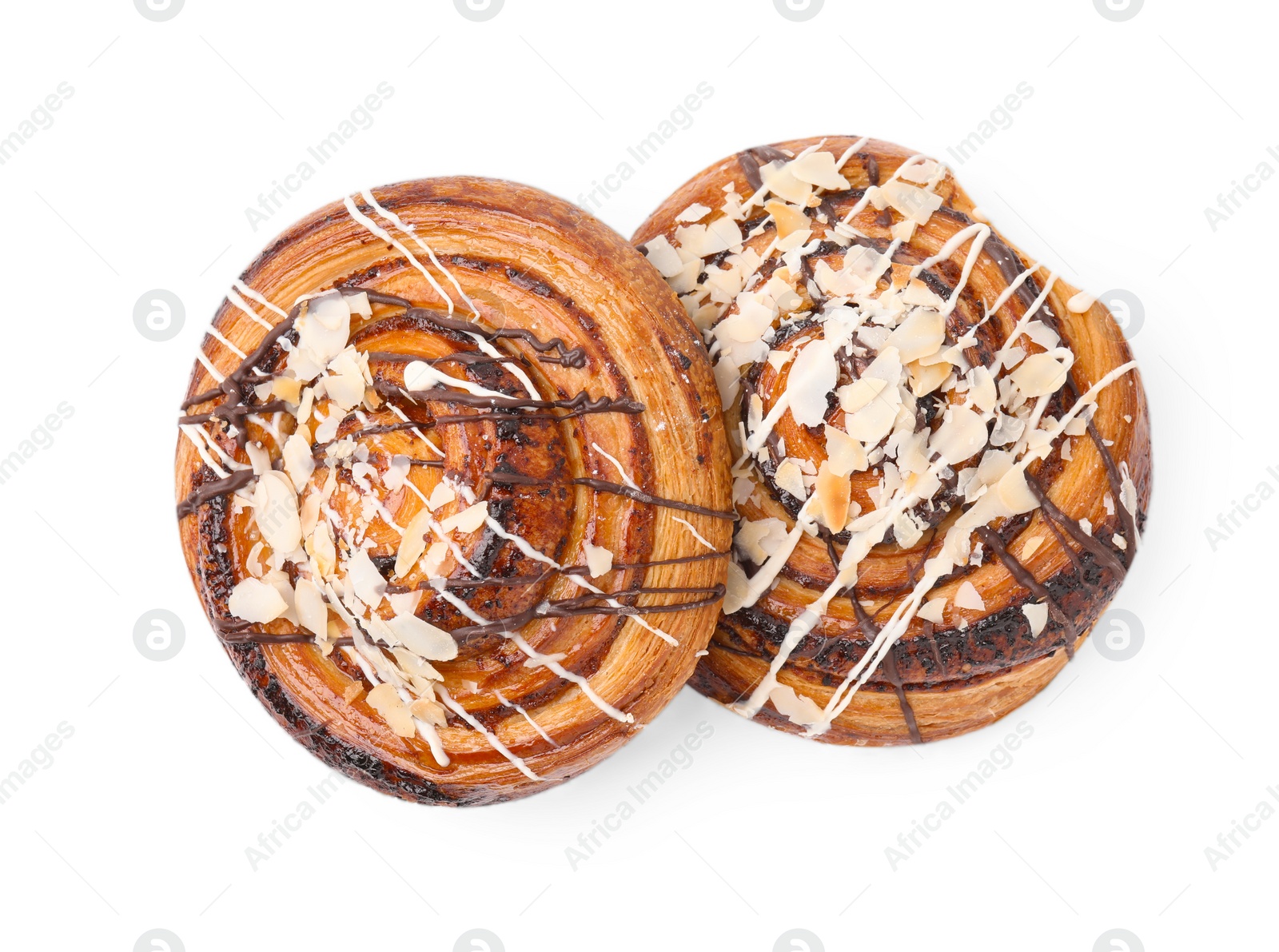 Photo of Delicious rolls with almond and toppings isolated on white, top view. Sweet buns