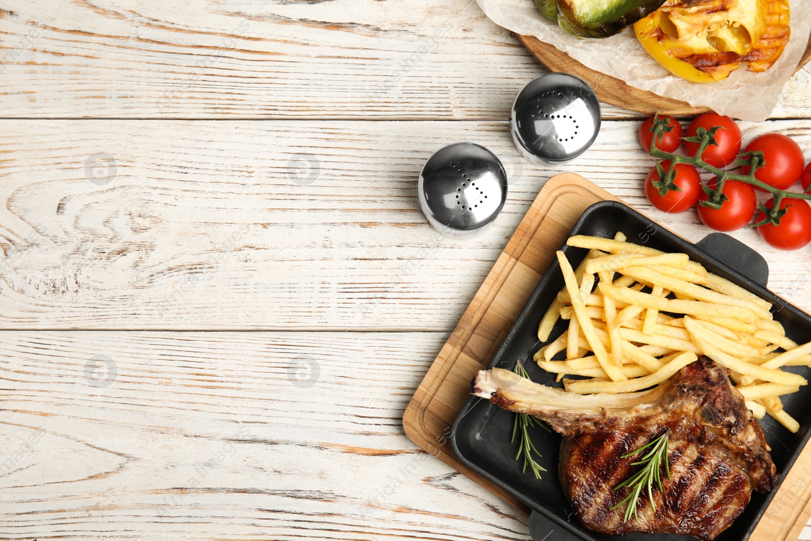 Photo of Flat lay composition with grilled beef steak on white wooden table, space for text