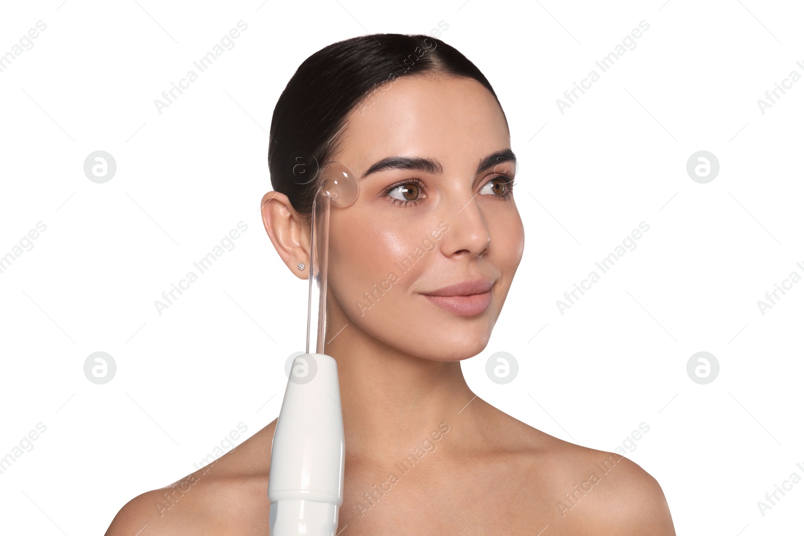 Photo of Woman using high frequency darsonval device on white background