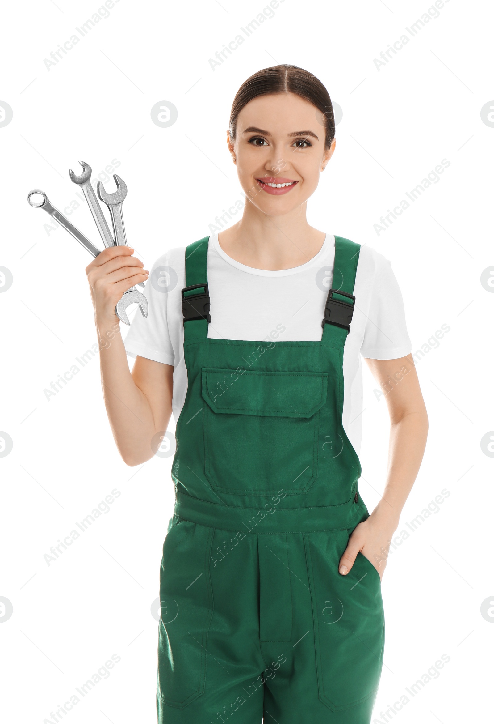 Photo of Portrait of professional auto mechanic with wrenches on white background