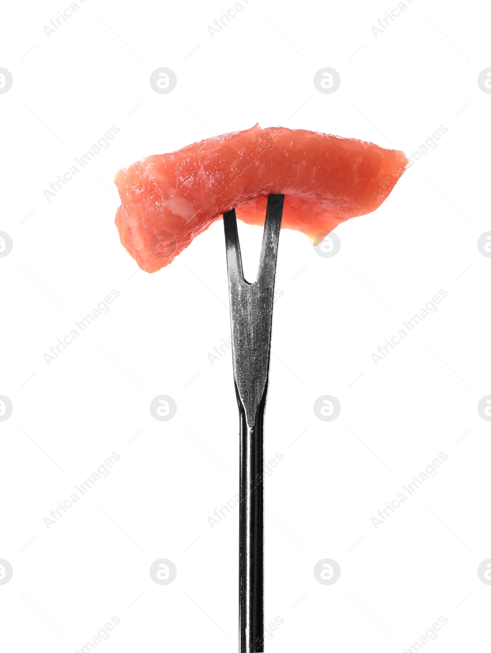 Photo of Fondue fork with piece of raw meat isolated on white