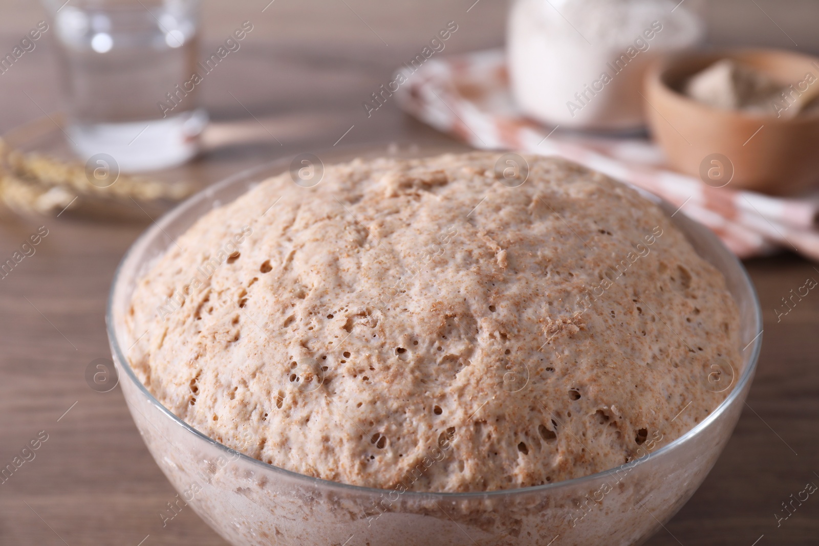 Photo of Fresh sourdough in bowl on table, closeup