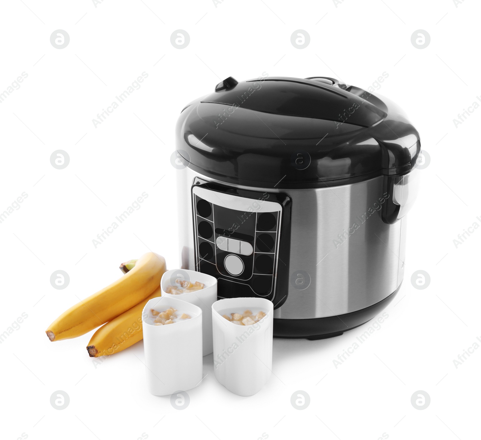 Photo of Multi cooker with yogurt and bananas isolated on white
