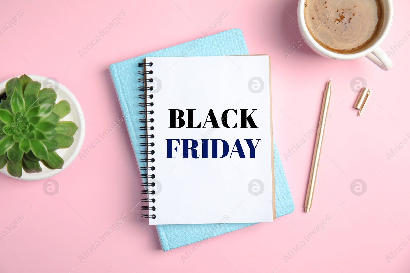 Image of Flat lay composition with notebooks and coffee on pink background. Black Friday Sale