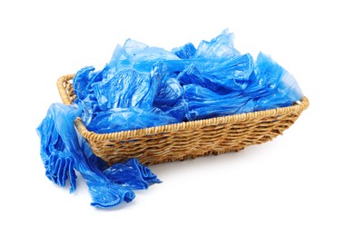 Basket with blue medical shoe covers isolated on white