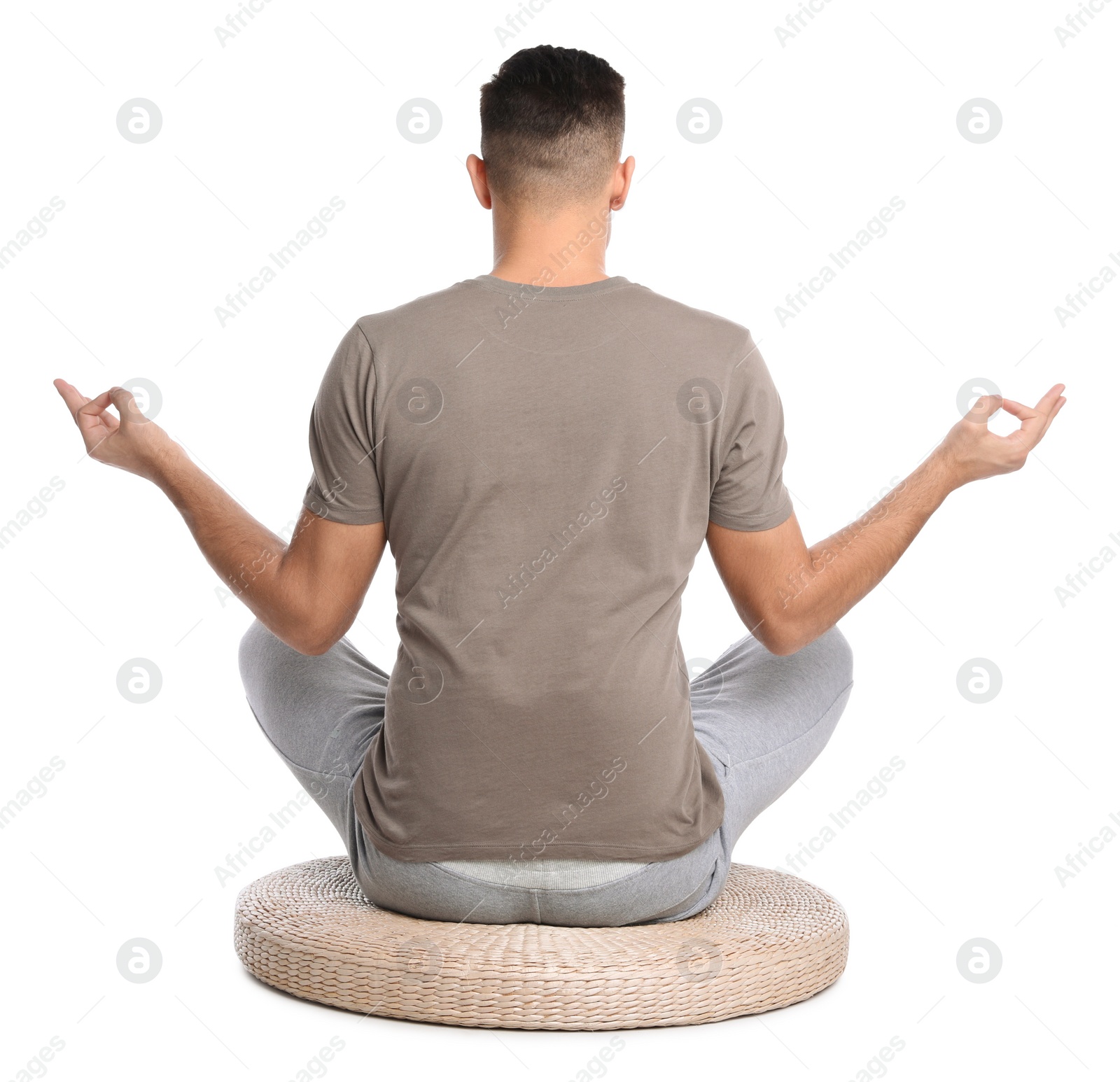 Photo of Man meditating on white background, back view