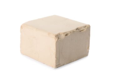 Photo of Block of compressed yeast on white background