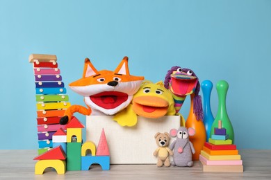 Photo of Collection of different toys on white wooden table