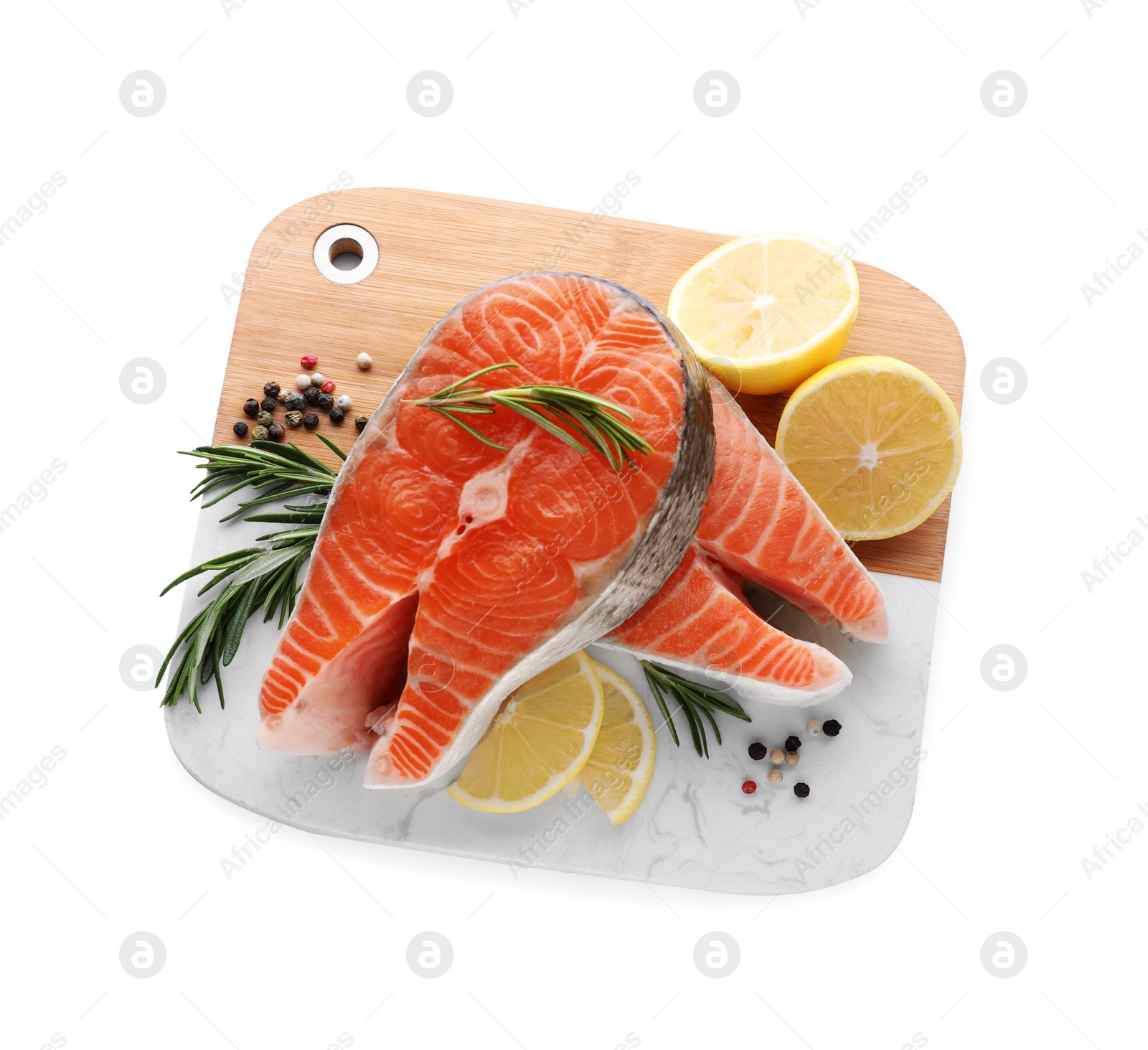 Photo of Fresh raw salmon steaks with rosemary, peppercorns and lemon on white background, top view