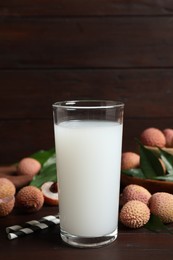 Photo of Lychee juice and fresh fruits on wooden table