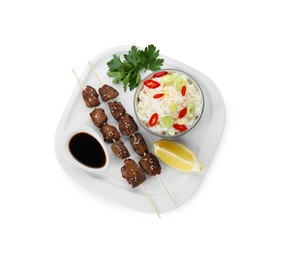 Photo of Tasty chicken meat glazed in soy sauce served with rice isolated on white, top view