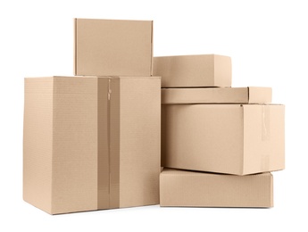 Photo of Pile of cardboard boxes on white background