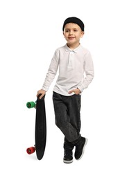 Photo of Fashion concept. Stylish boy with skateboard on white background