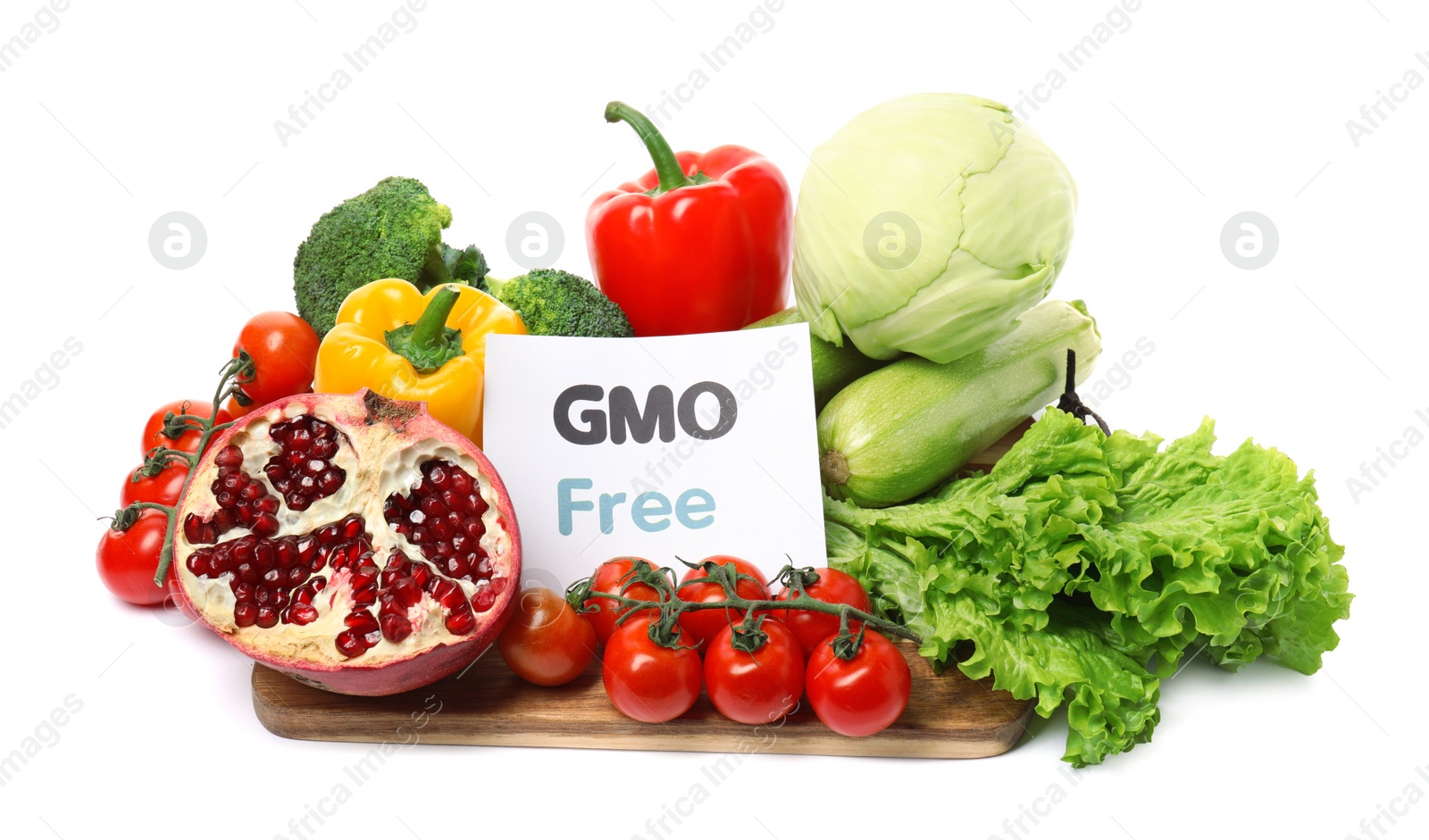 Photo of Tasty fresh GMO free products and paper card on white background