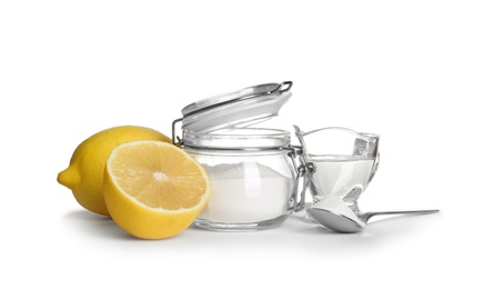 Photo of Composition with vinegar, lemons and baking soda on white background