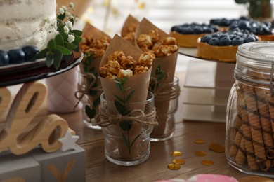 Photo of Delicious party treats on wooden table indoors