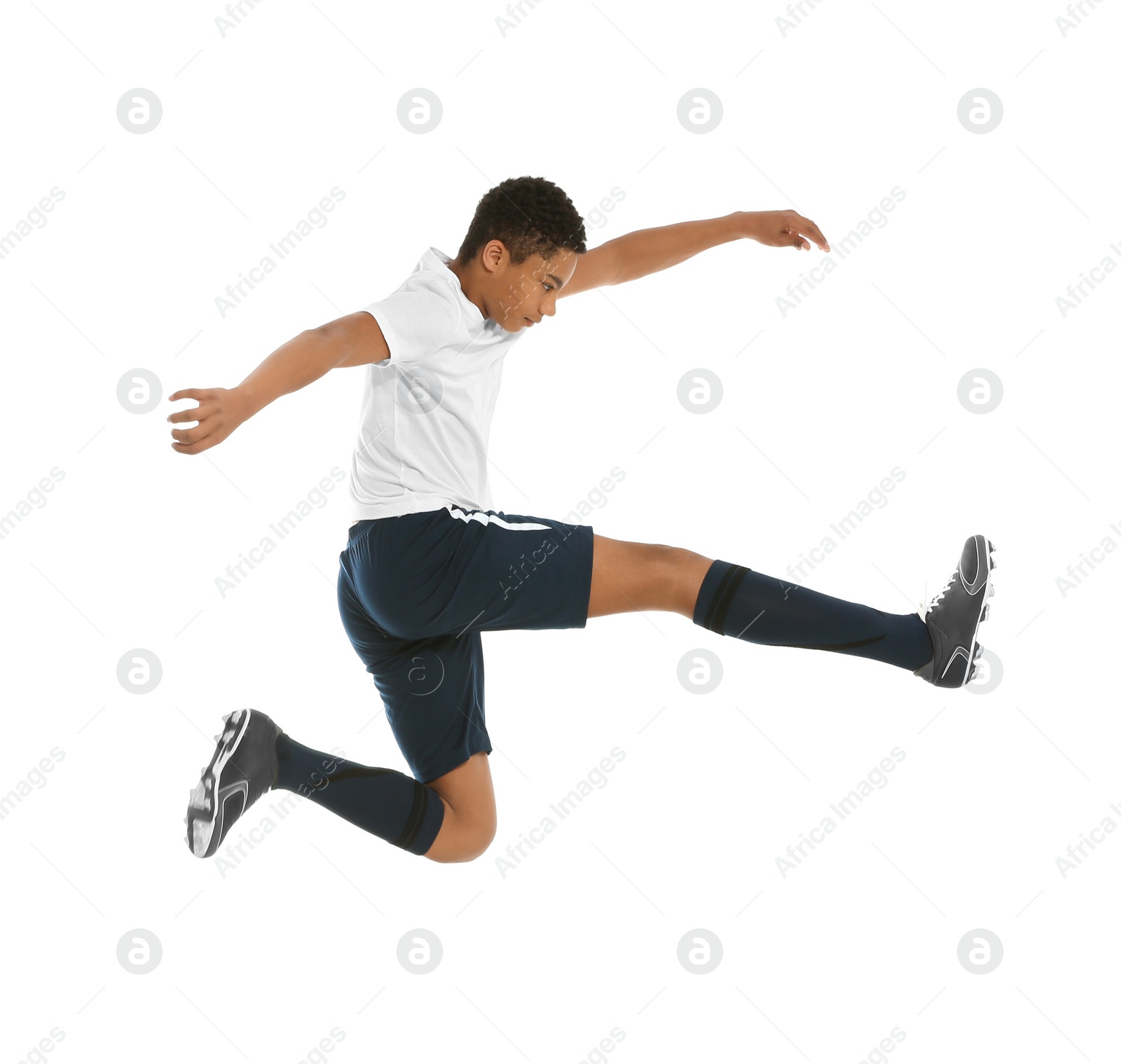 Photo of Teenage African-American boy playing football on white background