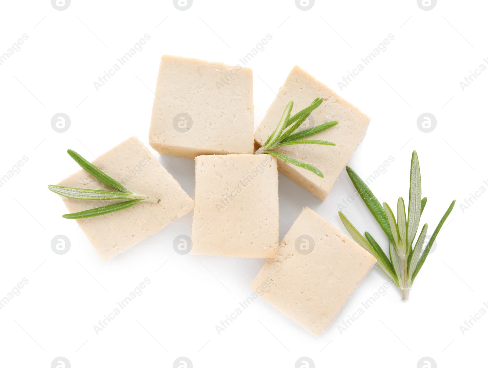 Photo of Delicious tofu and rosemary on white background, top view