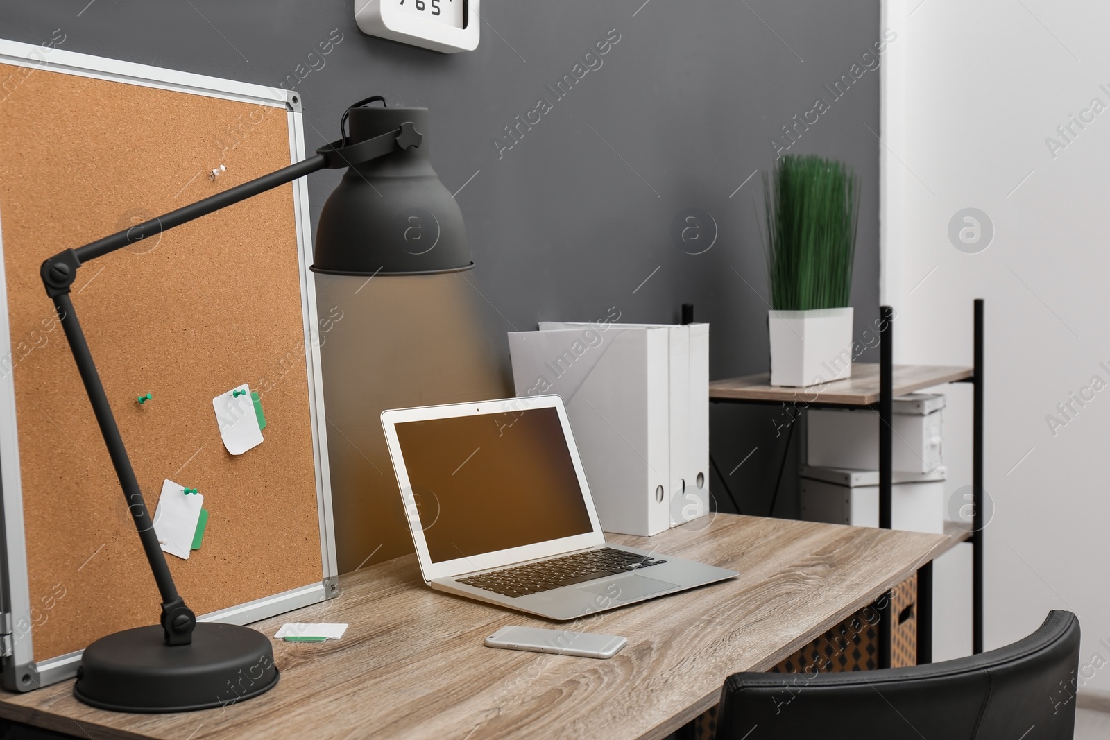 Photo of Stylish workplace with modern laptop in home office