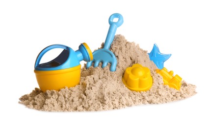 Plastic beach toys on pile of sand against white background. Outdoor play