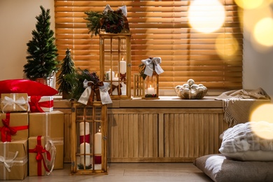 Photo of Beautiful wooden Christmas lanterns in decorated room