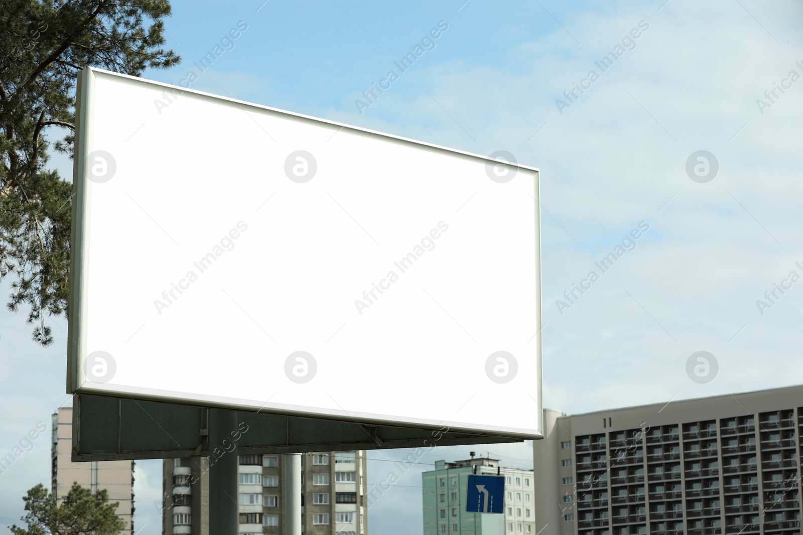 Photo of Blank advertising board in city. Mockup for design