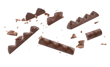 Image of Tasty chocolate bars falling on white background